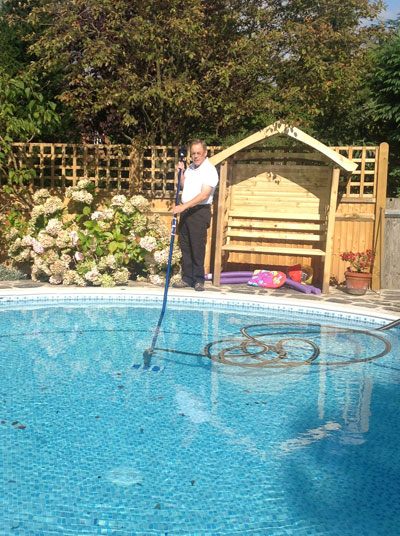 Terry cleaning his pool 
